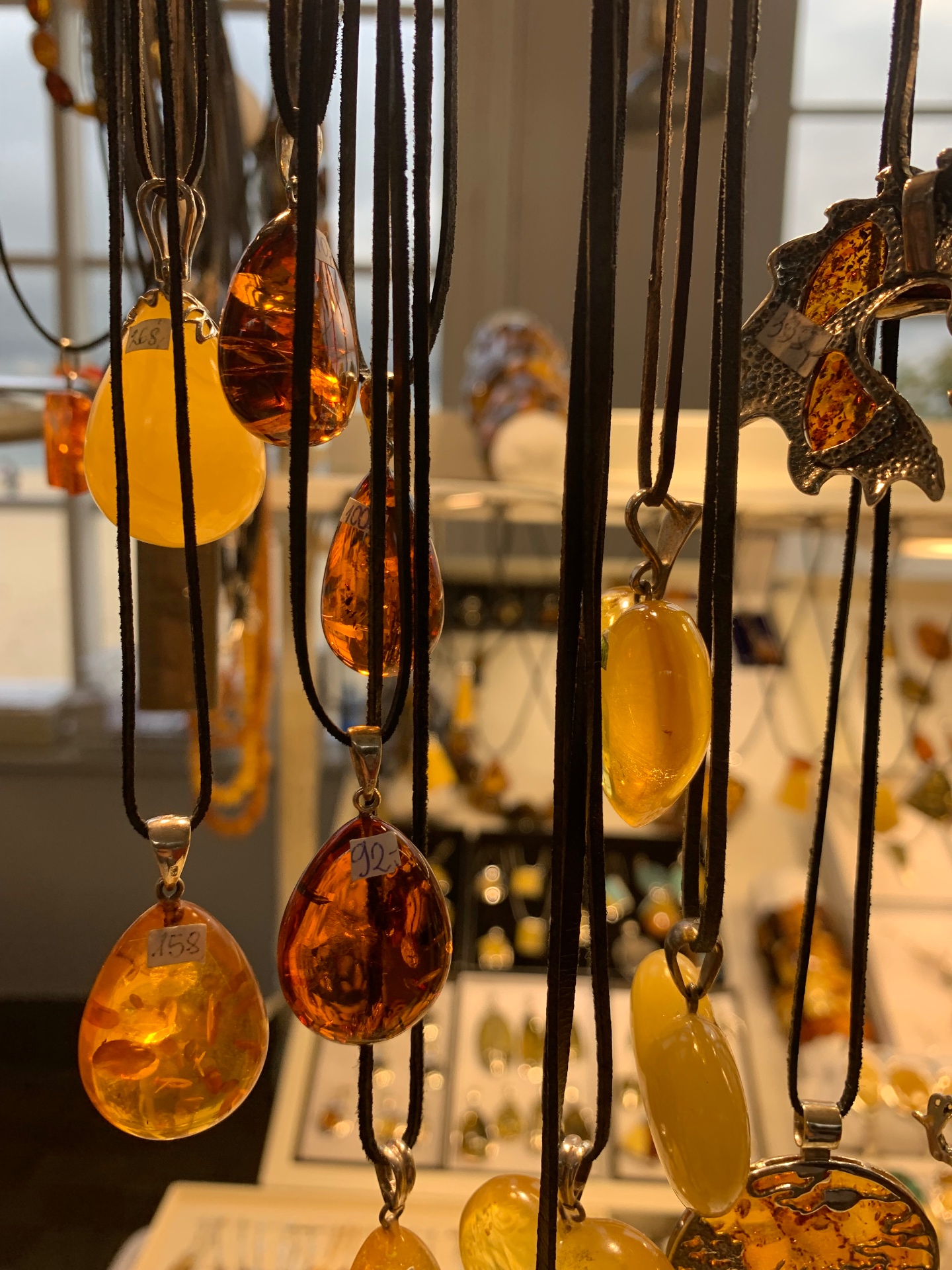Traditional Baltic amber jewelry - beautiful honey and cognac colored pendants, a regional treasure from the sea