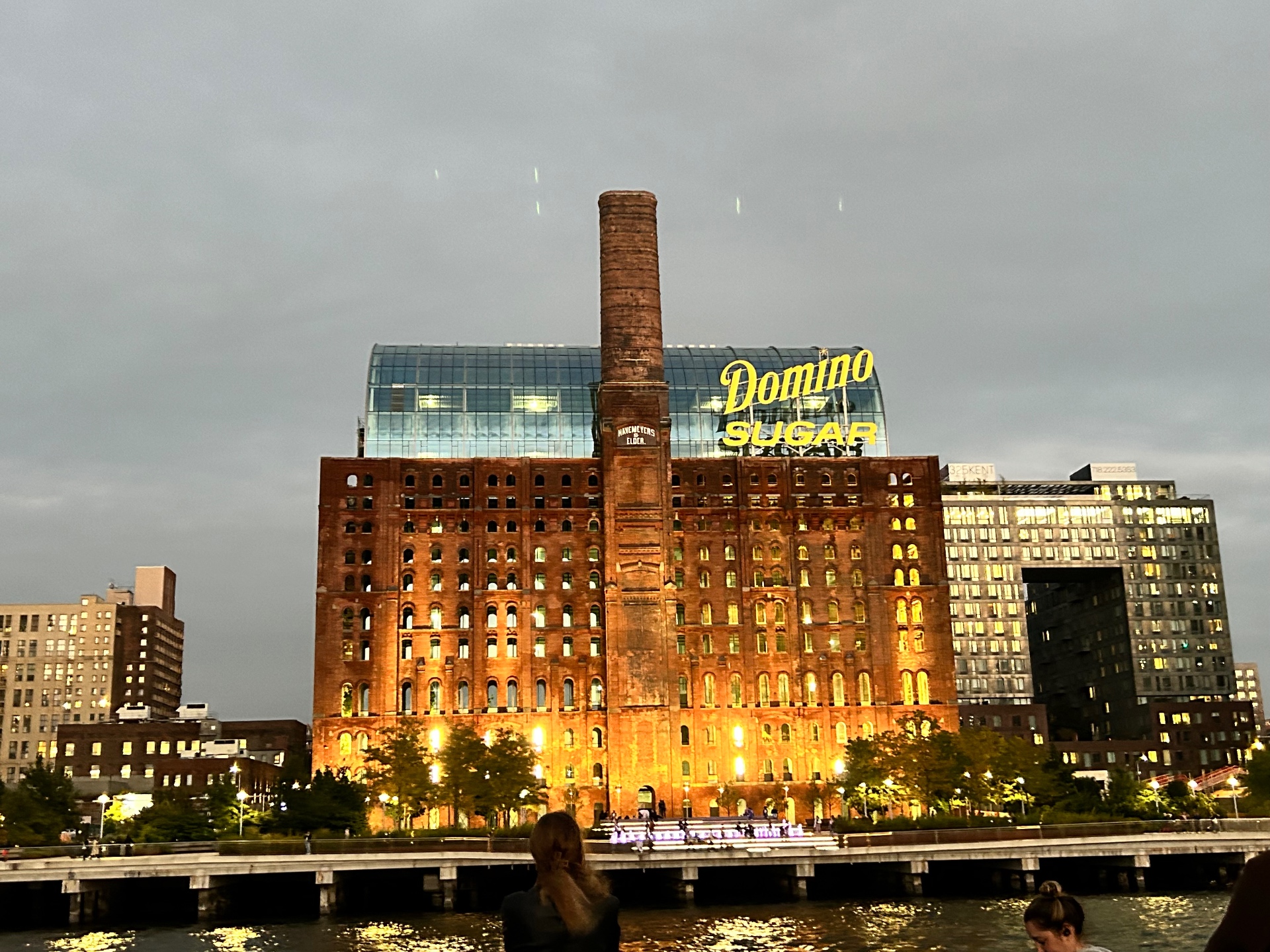 The historic Domino Sugar Factory in Williamsburg - an iconic Brooklyn landmark illuminated at dusk