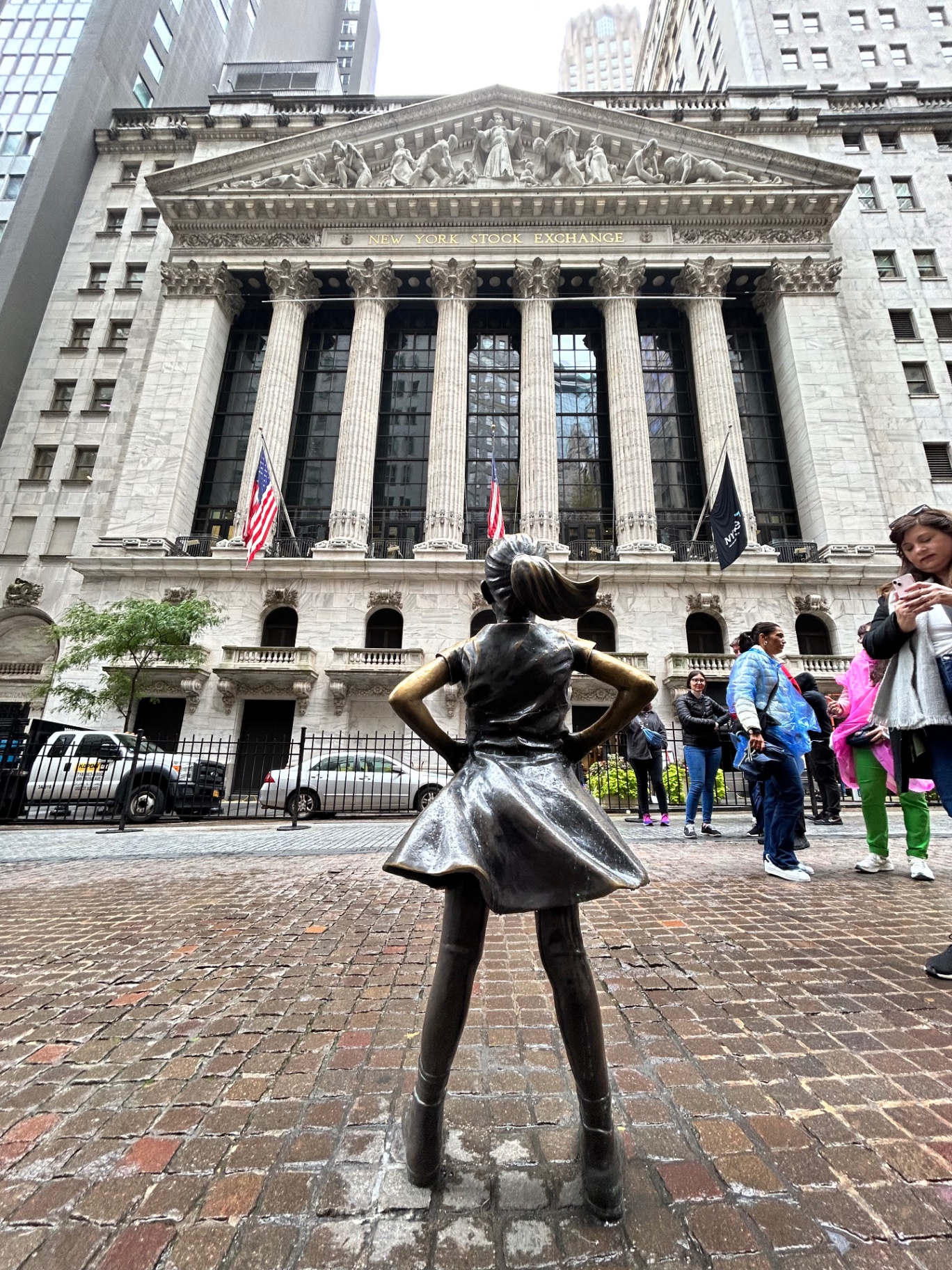 The Fearless Girl statue facing the New York Stock Exchange - a symbol of female empowerment on Wall Street